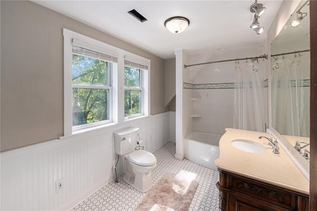 118 Spruce St, Leavenworth, KS 66048 - bathroom with vanity, wainscoting, and shower / tub combo