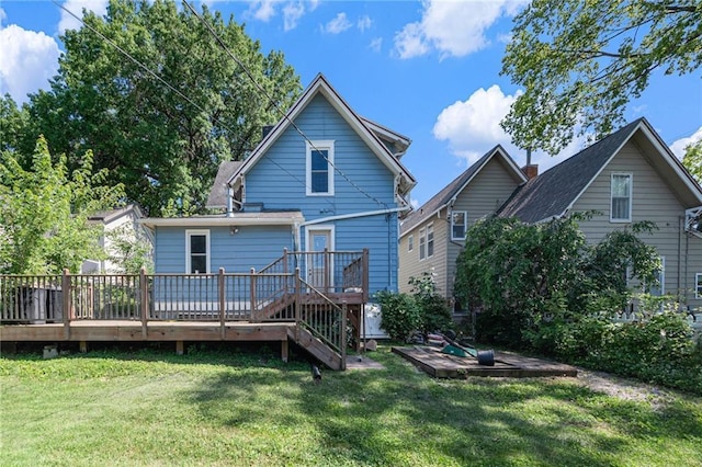 118 Spruce St, Leavenworth, KS 66048 - back of property featuring a wooden deck, a lawn, and stairs