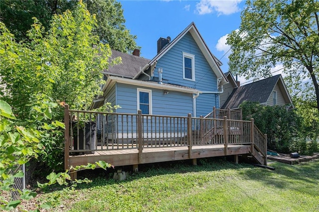 118 Spruce St, Leavenworth, KS 66048 - rear view of property featuring a yard, a wooden deck, roof with shingles, and a chimney