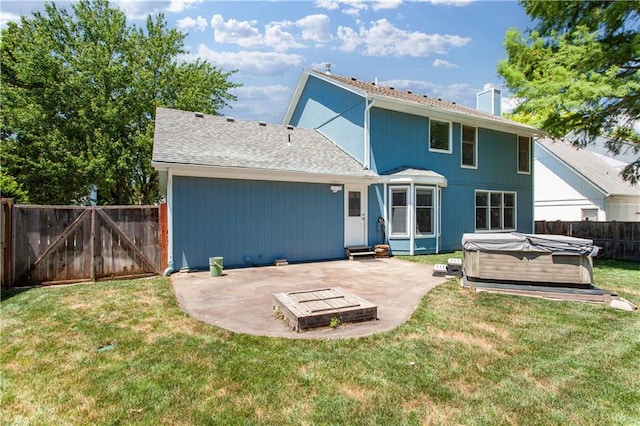 1321 SW Crossing Dr, Lees Summit, MO 64081 - rear view of property featuring a hot tub, a patio area, a fenced backyard, a chimney, and a gate
