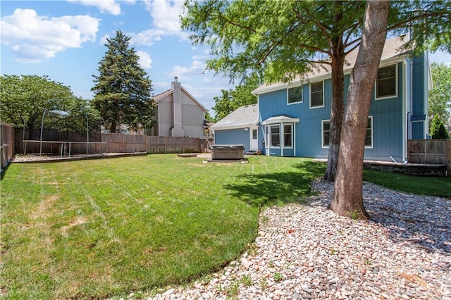 1321 SW Crossing Dr, Lees Summit, MO 64081 - fenced backyard featuring a hot tub