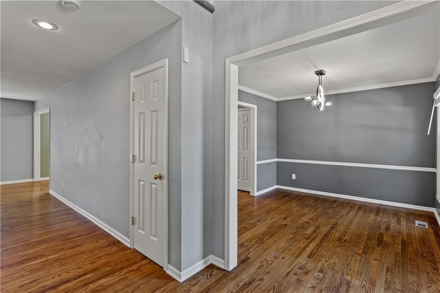 1321 SW Crossing Dr, Lees Summit, MO 64081 - hallway featuring wood finished floors, a chandelier, ornamental molding, and recessed lighting