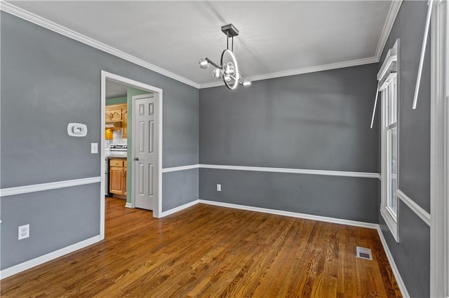 1321 SW Crossing Dr, Lees Summit, MO 64081 - empty room featuring a chandelier, dark wood-style flooring, and ornamental molding