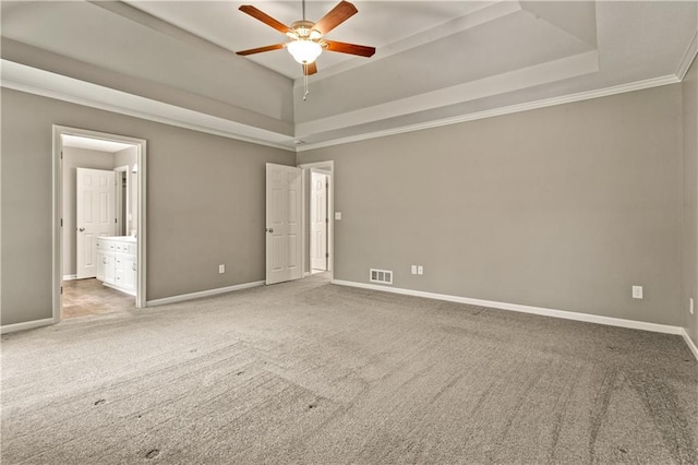 1321 SW Crossing Dr, Lees Summit, MO 64081 - empty room with ceiling fan, a tray ceiling, and carpet floors