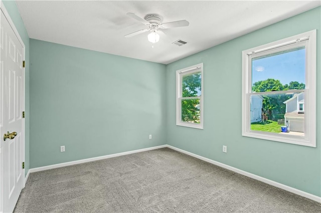 1321 SW Crossing Dr, Lees Summit, MO 64081 - carpeted spare room with a ceiling fan and baseboards