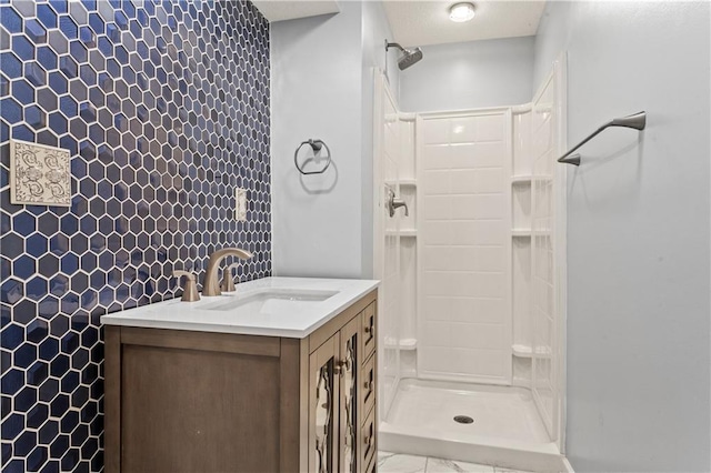 1321 SW Crossing Dr, Lees Summit, MO 64081 - bathroom featuring a shower, vanity, and marble look tile flooring