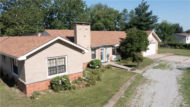 14610 State Route Dd Hwy, Savannah, MO 64485 - view of front of property with brick siding, a chimney, concrete driveway, a garage, and a front lawn