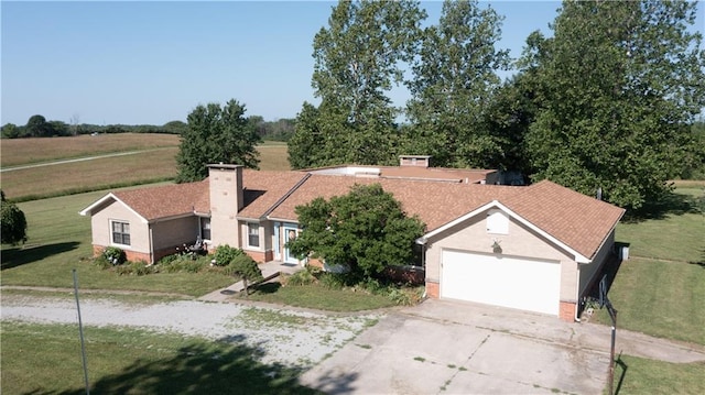 14610 State Route Dd Hwy, Savannah, MO 64485 - ranch-style home with concrete driveway, a front yard, a garage, and a chimney