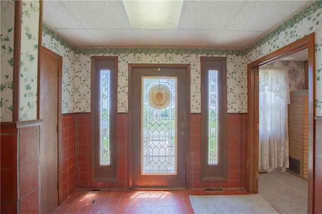 14610 State Route Dd Hwy, Savannah, MO 64485 - foyer entrance with wallpapered walls, a wainscoted wall, tile walls, and tile patterned flooring