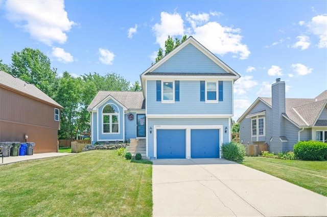 17277 W 157th St, Olathe, KS 66062 - view of front of home featuring a garage and concrete driveway