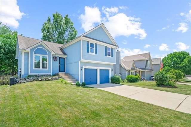 17277 W 157th St, Olathe, KS 66062 - view of front facade with an attached garage, driveway, and a front yard