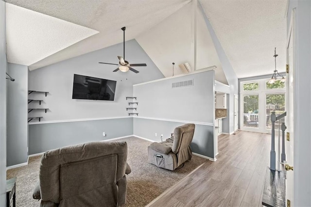17277 W 157th St, Olathe, KS 66062 - living area featuring a ceiling fan, a textured ceiling, wood finished floors, and high vaulted ceiling
