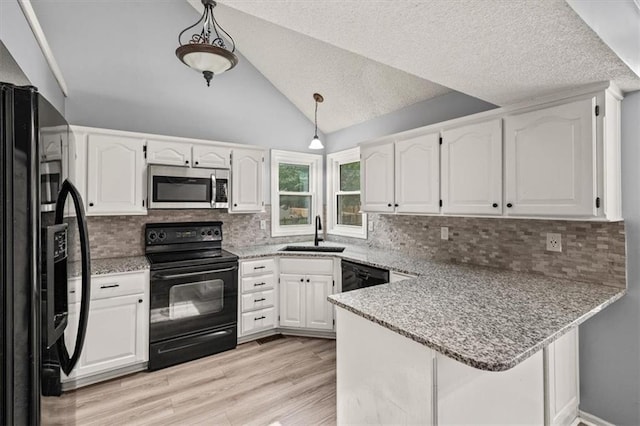 17277 W 157th St, Olathe, KS 66062 - kitchen featuring black appliances, a peninsula, white cabinets, tasteful backsplash, and lofted ceiling