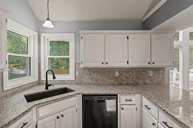 17277 W 157th St, Olathe, KS 66062 - kitchen featuring dishwashing machine, tasteful backsplash, white cabinetry, a textured ceiling, and lofted ceiling