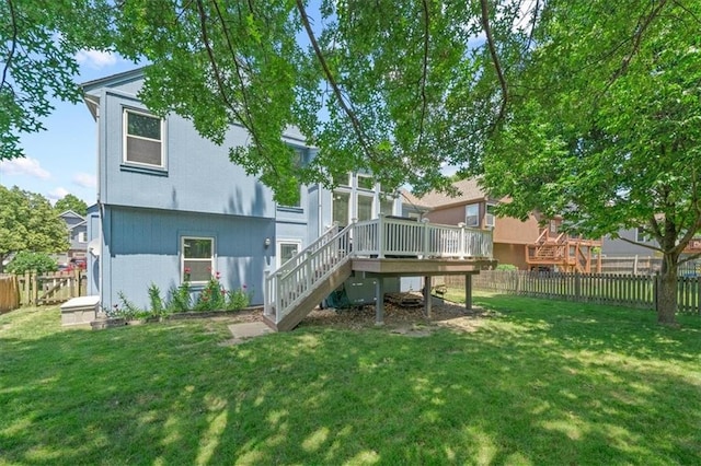 17277 W 157th St, Olathe, KS 66062 - rear view of house with stairway, a deck, and a fenced backyard