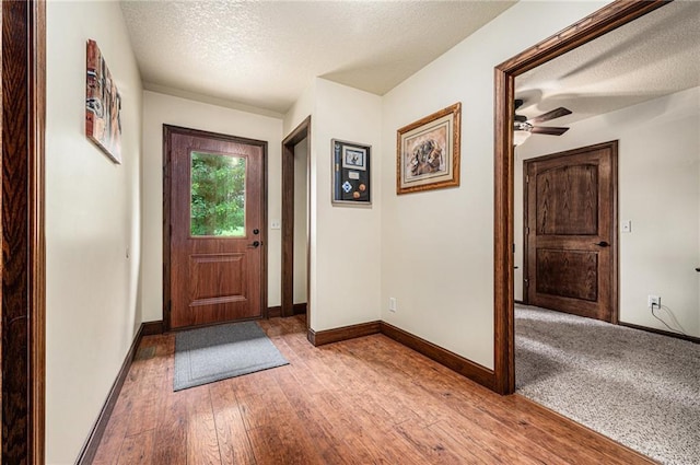 9750 SW 200th St, Smithville, MO 64089 - foyer with a textured ceiling, hardwood / wood-style flooring, and a ceiling fan