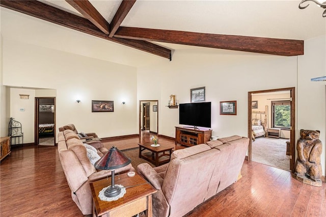 9750 SW 200th St, Smithville, MO 64089 - living area featuring beam ceiling, dark wood finished floors, and high vaulted ceiling
