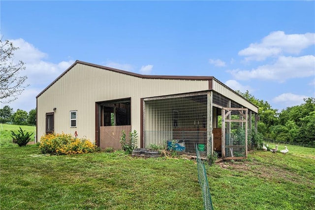9750 SW 200th St, Smithville, MO 64089 - view of side of home with an outbuilding and a lawn