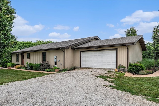 9750 SW 200th St, Smithville, MO 64089 - ranch-style home featuring driveway, a garage, a front yard, and a shingled roof