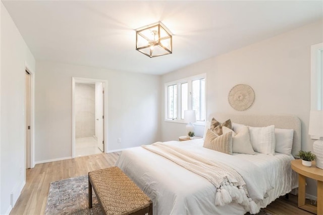 5308 Foster St, Mission, KS 66202 - bedroom with light wood-style flooring and ensuite bathroom
