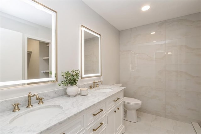 5308 Foster St, Mission, KS 66202 - full bathroom featuring double vanity, marble look tiles, a shower, and recessed lighting