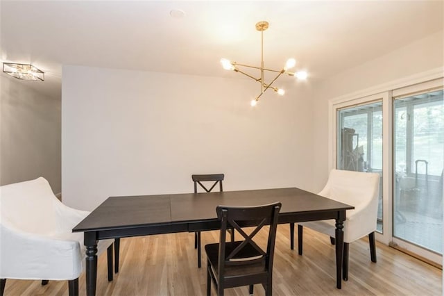 5308 Foster St, Mission, KS 66202 - dining space featuring a chandelier and light wood finished floors