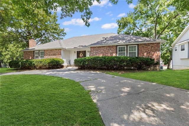 10131 W 84th St, Overland Park, KS 66212 - single story home featuring a chimney, a front lawn, and brick siding
