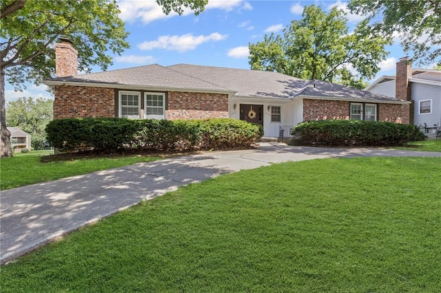 10131 W 84th St, Overland Park, KS 66212 - single story home featuring brick siding, a front lawn, and a chimney