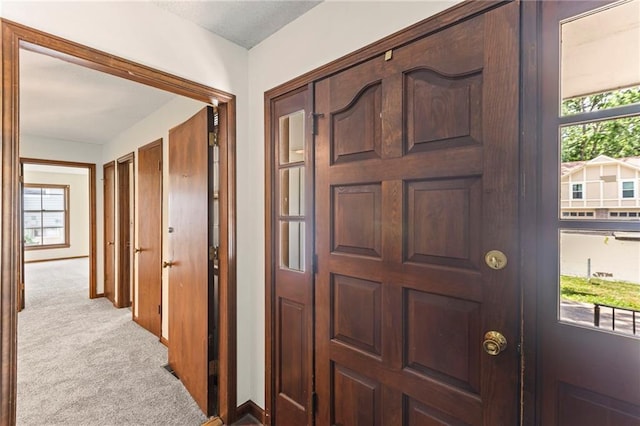10131 W 84th St, Overland Park, KS 66212 - carpeted entryway featuring baseboards