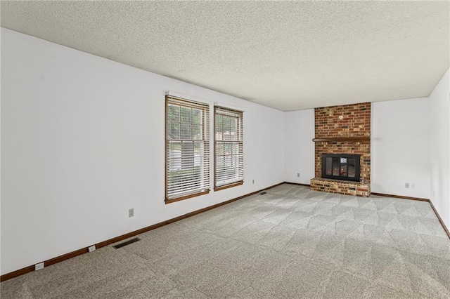 10131 W 84th St, Overland Park, KS 66212 - unfurnished living room featuring carpet flooring, a textured ceiling, and a brick fireplace