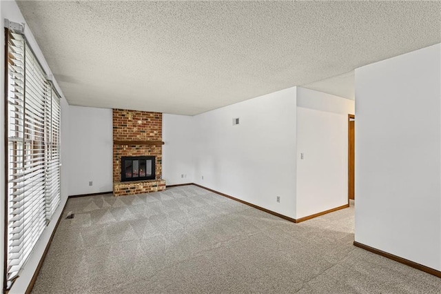 10131 W 84th St, Overland Park, KS 66212 - unfurnished living room with carpet flooring, a fireplace, and a textured ceiling