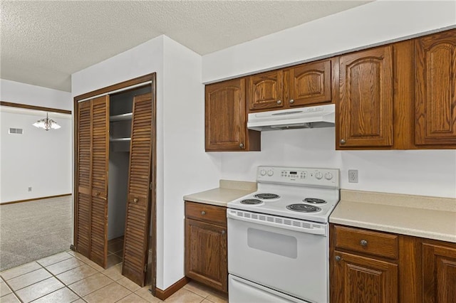 10131 W 84th St, Overland Park, KS 66212 - kitchen with white electric range oven, under cabinet range hood, light countertops, a chandelier, and a textured ceiling