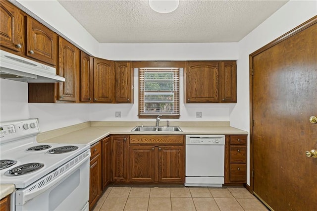 10131 W 84th St, Overland Park, KS 66212 - kitchen with white appliances, under cabinet range hood, a textured ceiling, and light countertops