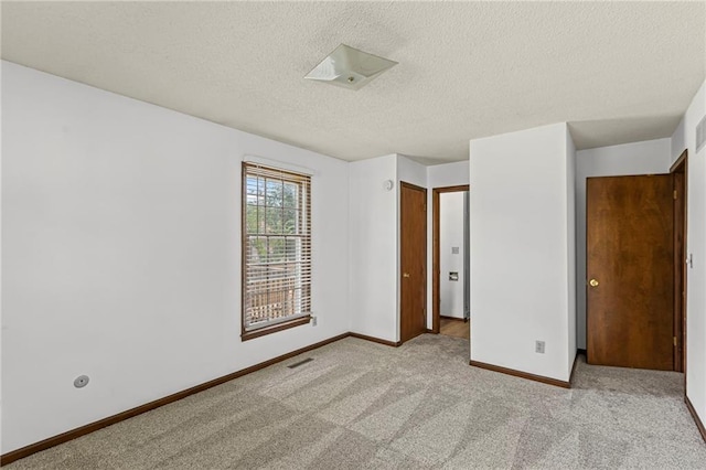 10131 W 84th St, Overland Park, KS 66212 - unfurnished bedroom with a textured ceiling and carpet flooring