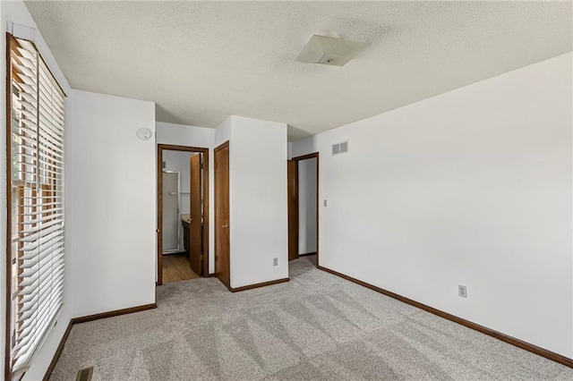 10131 W 84th St, Overland Park, KS 66212 - unfurnished bedroom featuring carpet and a textured ceiling