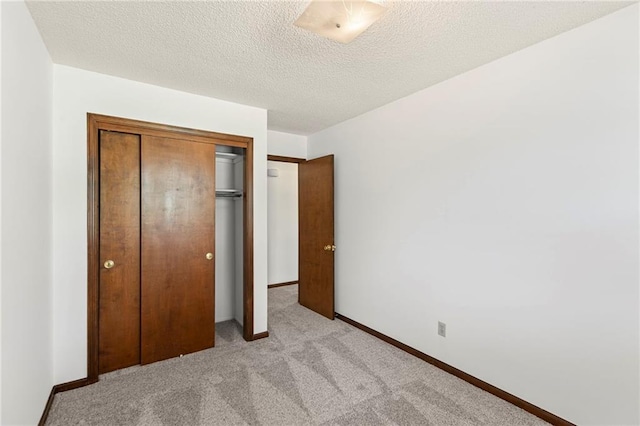 10131 W 84th St, Overland Park, KS 66212 - unfurnished bedroom featuring light colored carpet, a closet, and a textured ceiling