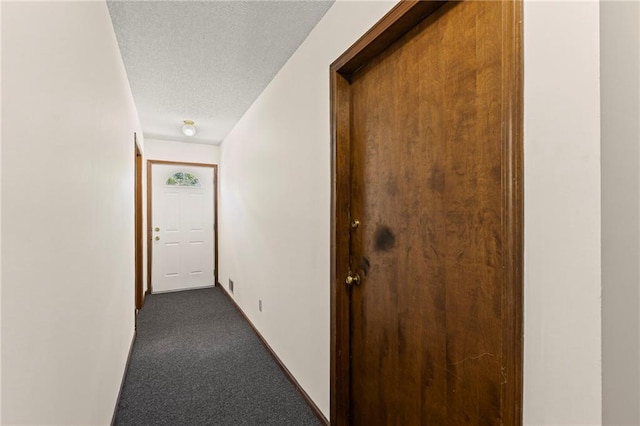 10131 W 84th St, Overland Park, KS 66212 - hall with dark colored carpet and a textured ceiling