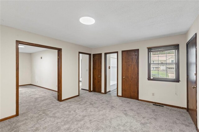 10131 W 84th St, Overland Park, KS 66212 - unfurnished bedroom featuring carpet floors and a textured ceiling