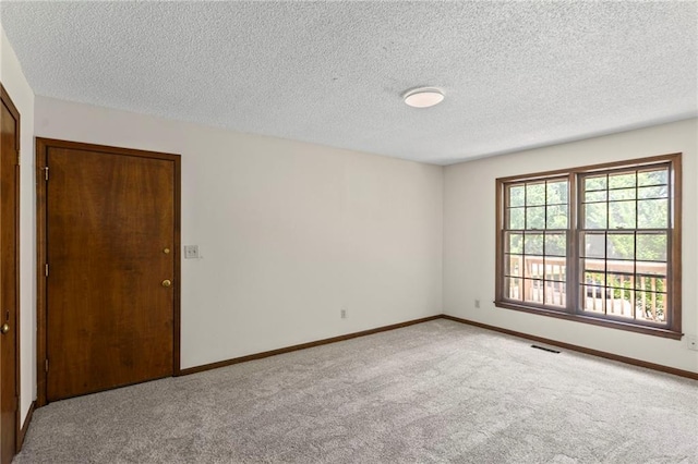 10131 W 84th St, Overland Park, KS 66212 - spare room featuring carpet and a textured ceiling