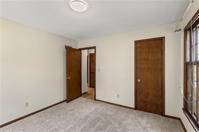 10131 W 84th St, Overland Park, KS 66212 - unfurnished bedroom featuring carpet floors and a textured ceiling