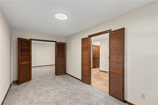 10131 W 84th St, Overland Park, KS 66212 - unfurnished bedroom featuring light carpet and baseboards