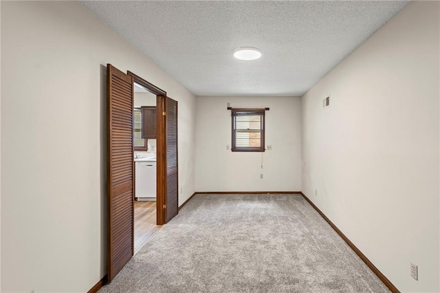 10131 W 84th St, Overland Park, KS 66212 - unfurnished room with light carpet and a textured ceiling