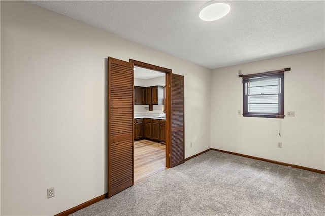 10131 W 84th St, Overland Park, KS 66212 - empty room featuring light colored carpet and a textured ceiling