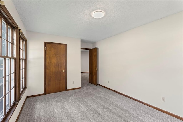 10131 W 84th St, Overland Park, KS 66212 - unfurnished bedroom with a textured ceiling and carpet