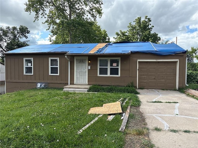 6310 E 153rd St, Grandview, MO 64030 - single story home featuring concrete driveway, a front lawn, an attached garage, and board and batten siding