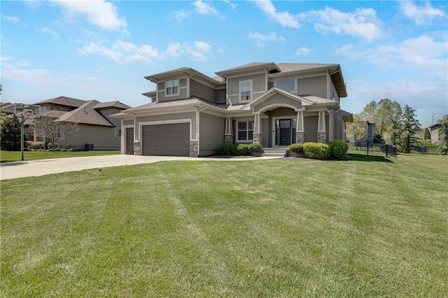 204 SW Ansel Adams Dr, Lees Summit, MO 64081 - prairie-style home featuring stone siding, driveway, a front yard, and a garage