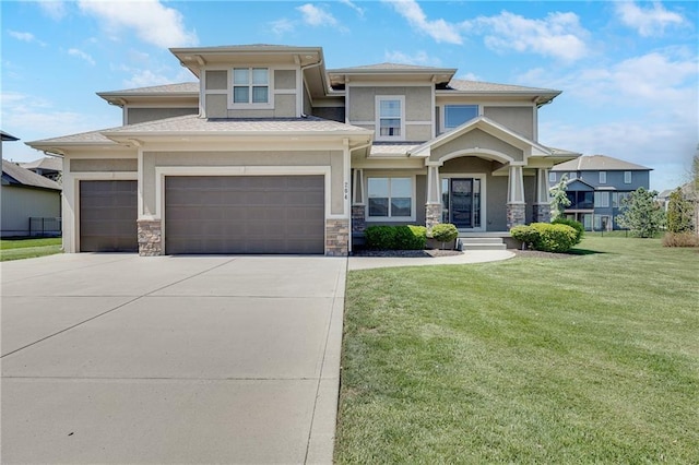 204 SW Ansel Adams Dr, Lees Summit, MO 64081 - prairie-style home with stucco siding, driveway, a front lawn, and stone siding