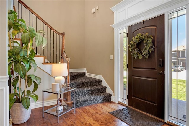 204 SW Ansel Adams Dr, Lees Summit, MO 64081 - entryway featuring stairway, plenty of natural light, and hardwood / wood-style flooring