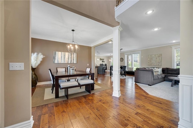 204 SW Ansel Adams Dr, Lees Summit, MO 64081 - dining room with decorative columns, crown molding, hardwood / wood-style floors, a chandelier, and recessed lighting