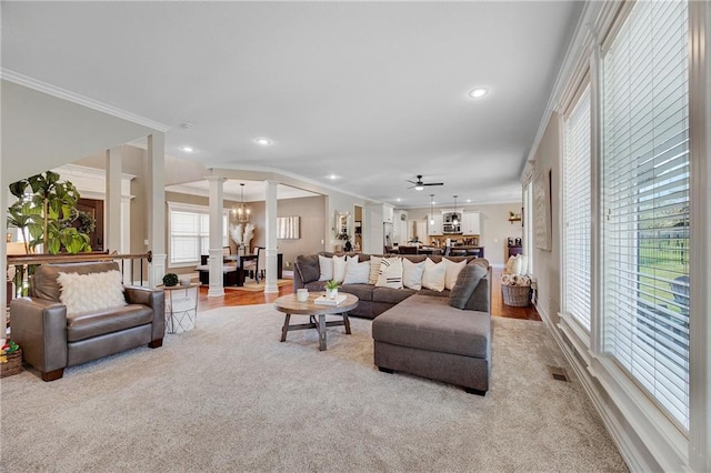 204 SW Ansel Adams Dr, Lees Summit, MO 64081 - living area featuring ornate columns, ornamental molding, a chandelier, recessed lighting, and carpet